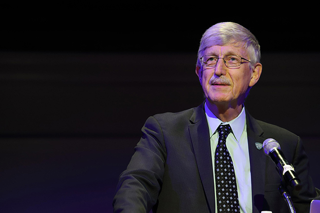 Dr. Francis Collins standing at a podium speaking at an event.