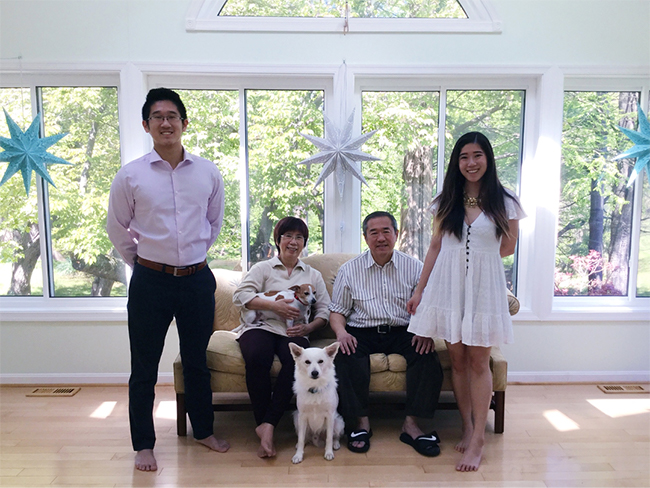 Judie poses with family and two new dogs
