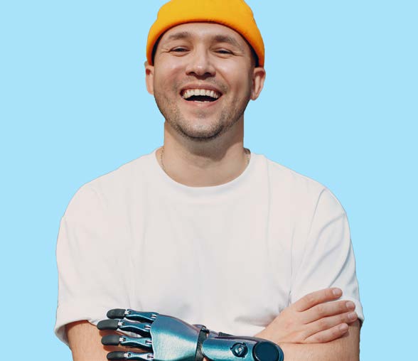 A smiling man with a prosthetic hand.