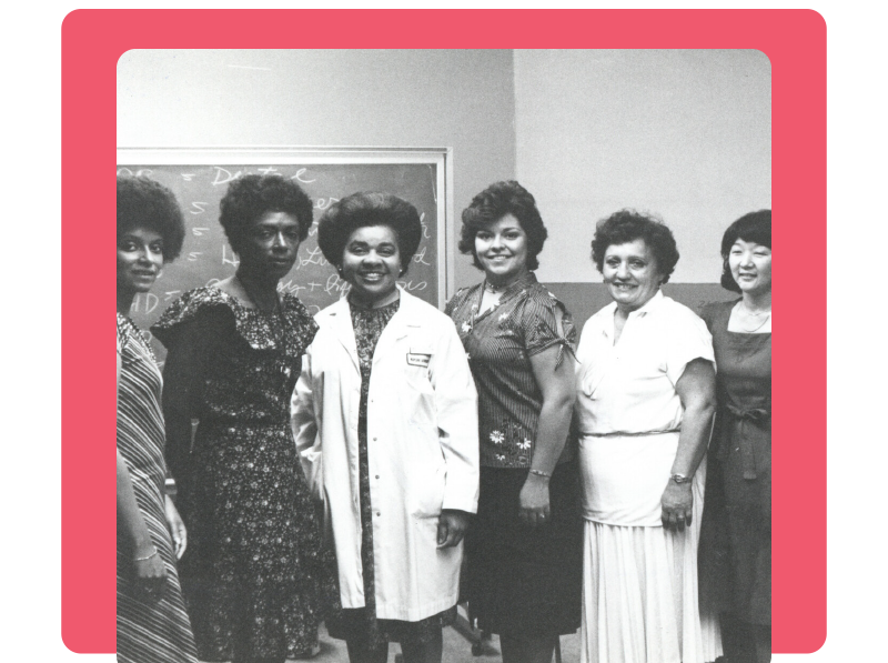 A group of women pose for a NIH staff photo.
