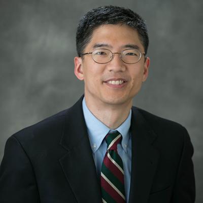 Closeup headshot of smiling Dr. Michael F. Chiang 