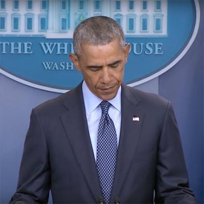 President Obama standing at the podium giving a speech.